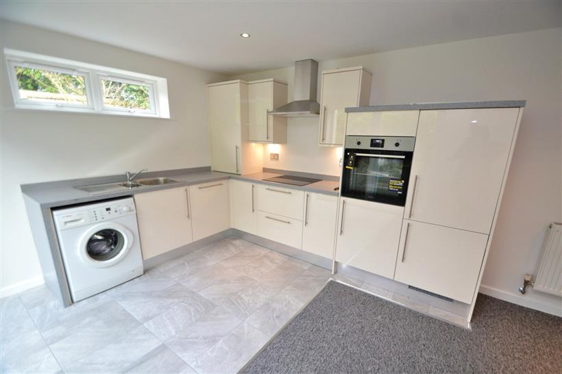 A Well Presented Ground Floor Apartment With Private Garden & Parking